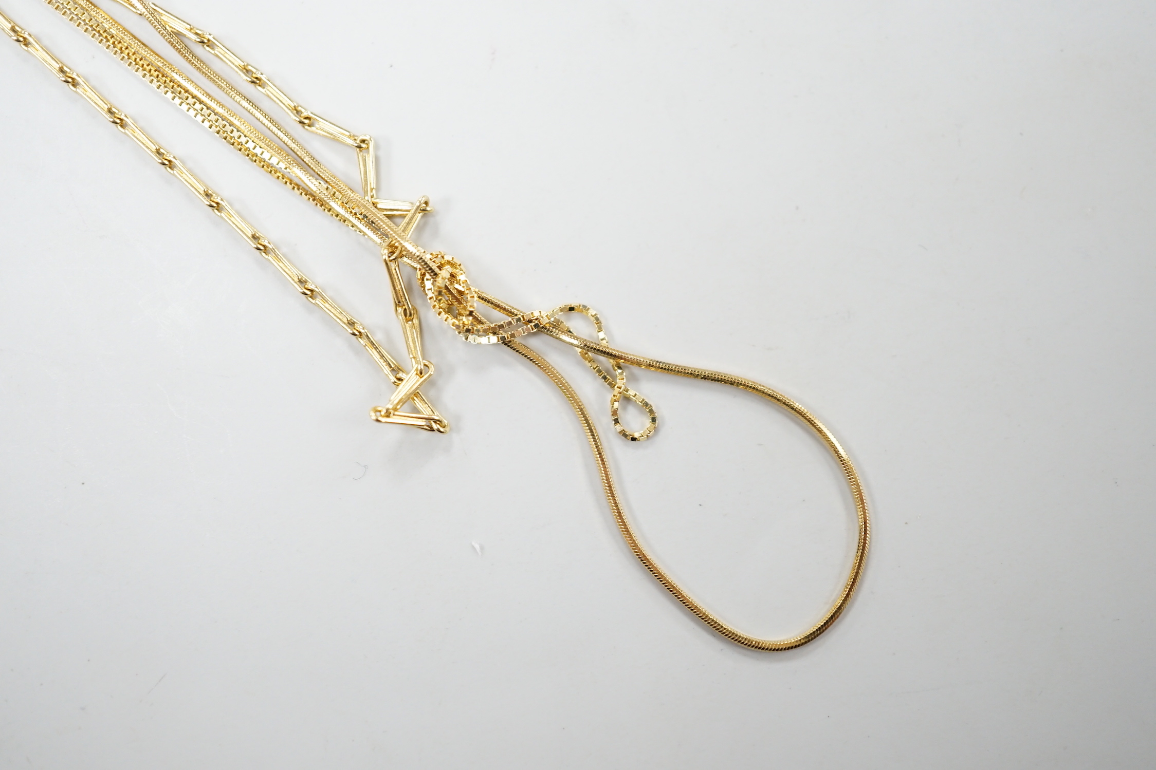 An 18ct gold fine baton link chain, 38cm and one other 750 chain, 7.3 grams and one 14kt chain, 0.9 grams.